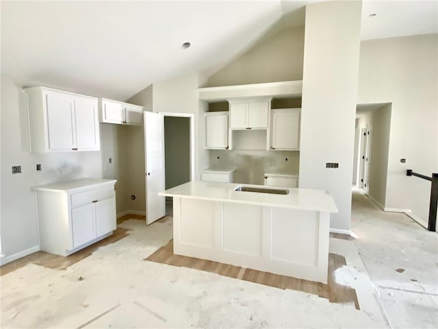 1103 Noah Ln, Kearney, MO 64060 - kitchen featuring a kitchen island, white cabinets, and high vaulted ceiling