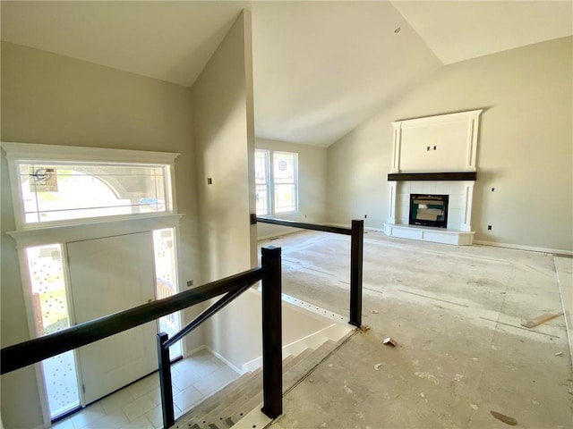 1103 Noah Ln, Kearney, MO 64060 - unfurnished living room with vaulted ceiling and a tiled fireplace