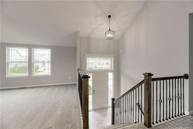 1103 Noah Ln, Kearney, MO 64060 - foyer entrance with a chandelier, carpet, and lofted ceiling