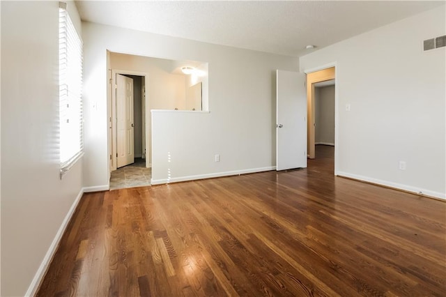 empty room with wood-type flooring