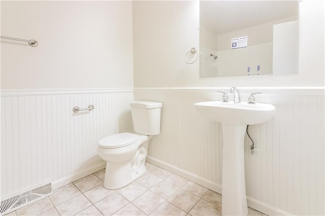 bathroom with tile patterned flooring and toilet