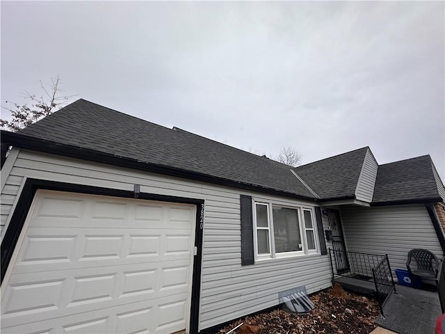 view of property exterior featuring a garage