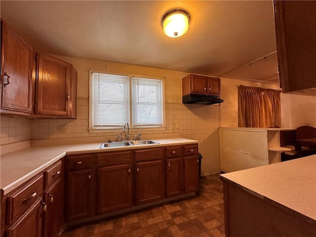 kitchen with sink and tile walls