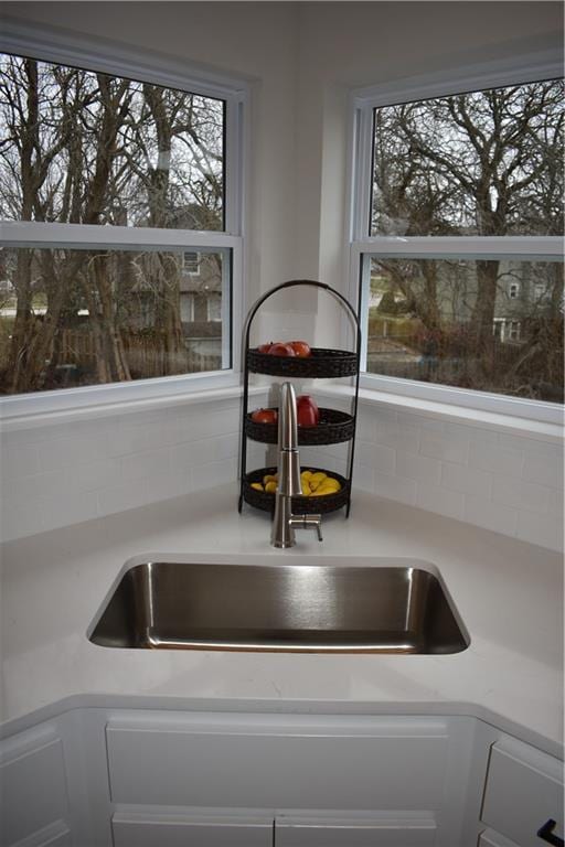 kitchen featuring sink and backsplash