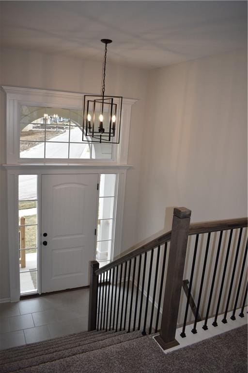 entrance foyer featuring a notable chandelier