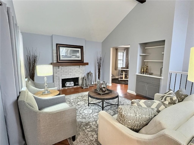 living room with wood-type flooring, a brick fireplace, and high vaulted ceiling