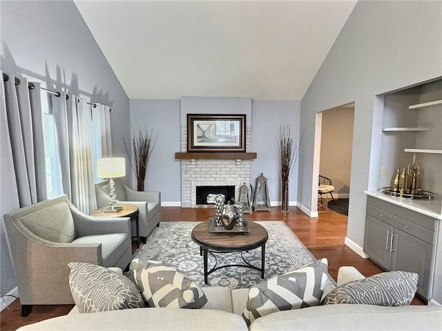 living room featuring lofted ceiling, a fireplace, and dark hardwood / wood-style flooring