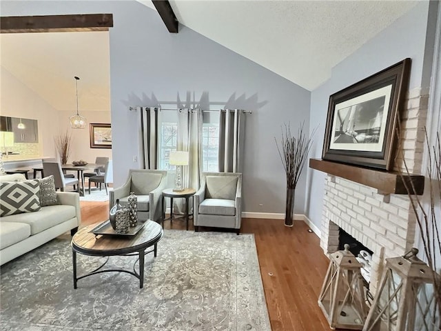 living room with a brick fireplace, dark hardwood / wood-style floors, high vaulted ceiling, and beam ceiling