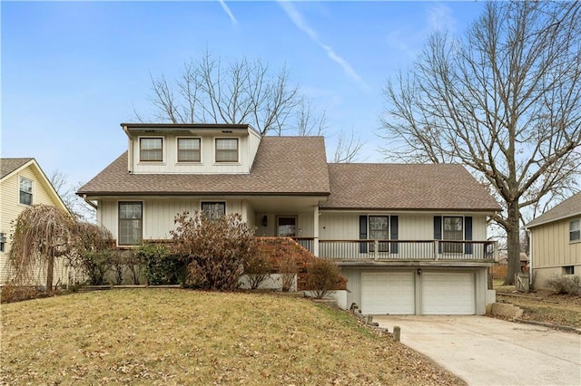 view of front of house with a garage and a front lawn