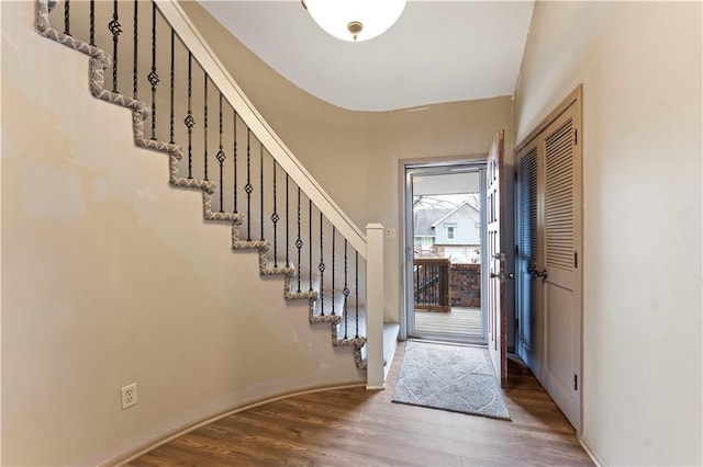 foyer with dark hardwood / wood-style flooring