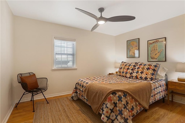 bedroom with light hardwood / wood-style flooring and ceiling fan