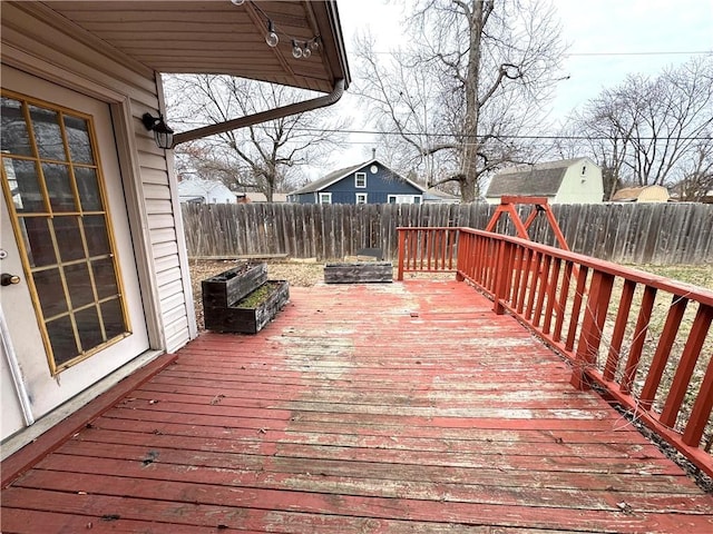 wooden deck featuring a playground