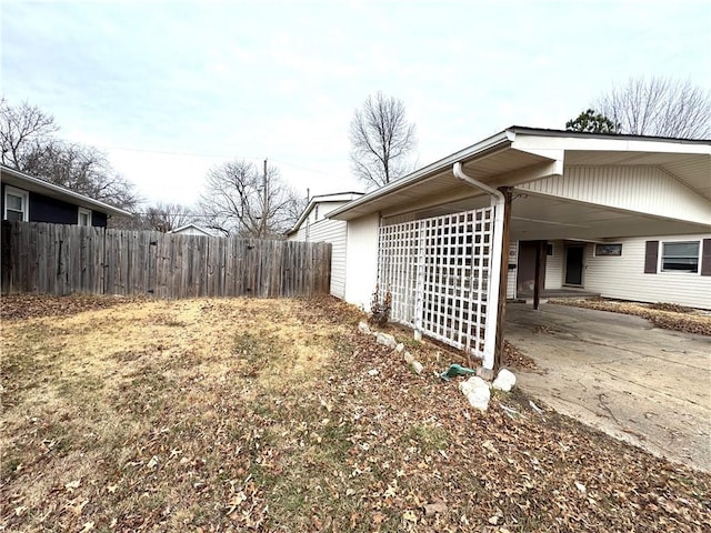 view of property exterior featuring a carport