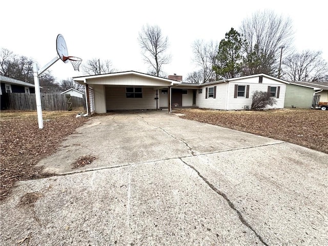 ranch-style home with a carport