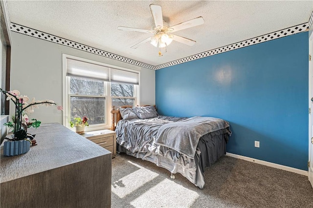 bedroom with carpet flooring, a textured ceiling, and baseboards