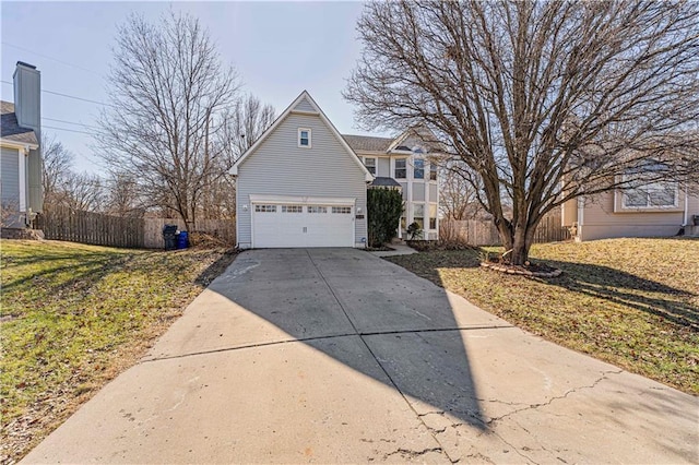 traditional home featuring driveway, a front yard, a garage, and fence