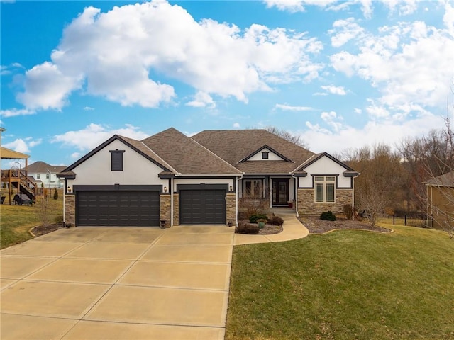 view of front of home with a garage and a front lawn