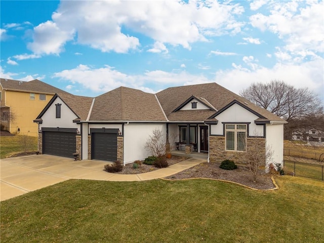 view of front of property with a garage and a front yard