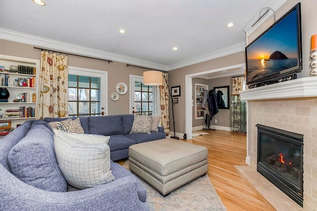 living room with crown molding and wood-type flooring