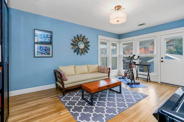 living room with light hardwood / wood-style flooring