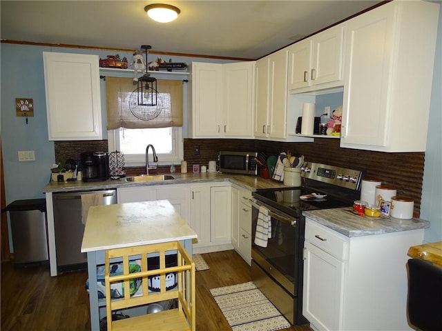 kitchen featuring white cabinetry, sink, and appliances with stainless steel finishes