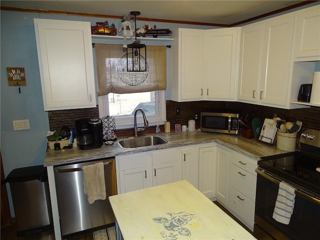 kitchen with stainless steel appliances, white cabinetry, sink, and tasteful backsplash