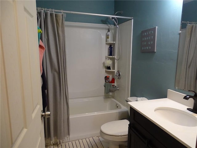 full bathroom featuring shower / tub combo, vanity, and toilet