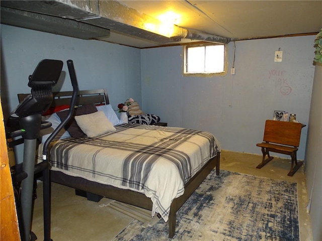 bedroom featuring concrete floors