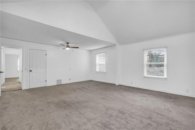 carpeted empty room featuring high vaulted ceiling and ceiling fan