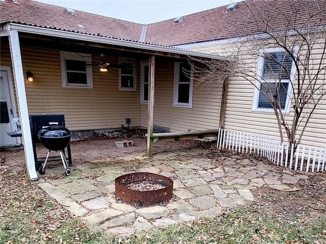 back of house featuring a patio and a fire pit