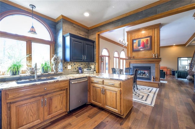 kitchen with dark wood-style flooring, crown molding, a fireplace, a sink, and dishwasher