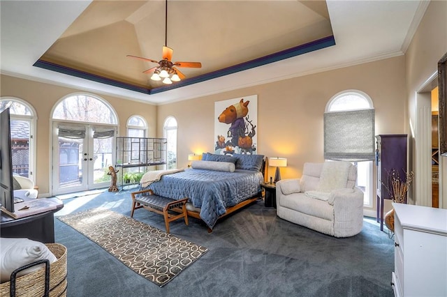 bedroom featuring crown molding, access to outside, a raised ceiling, and dark carpet