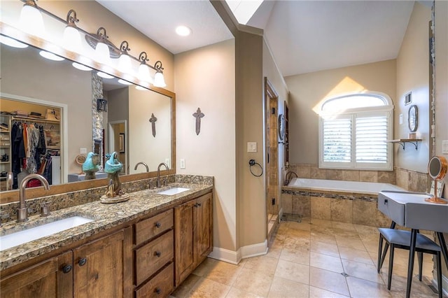 full bath with a bath, visible vents, a sink, and tile patterned floors