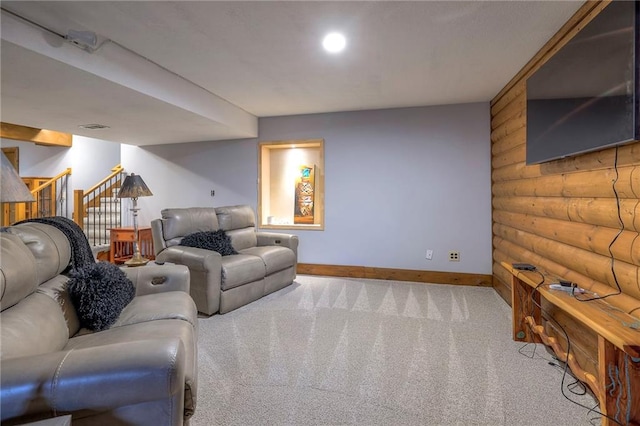 carpeted living room featuring stairway, visible vents, log walls, and baseboards