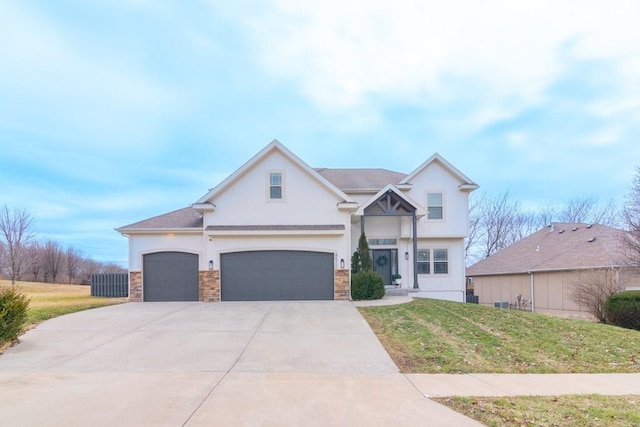 view of front of house with a front yard, driveway, and stucco siding