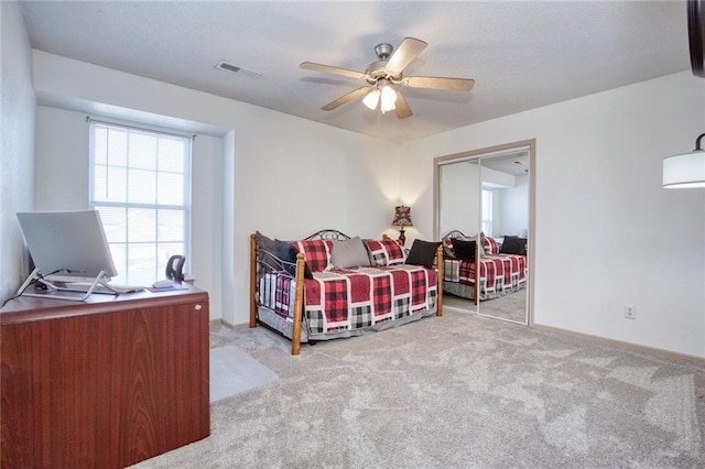 carpeted bedroom with ceiling fan