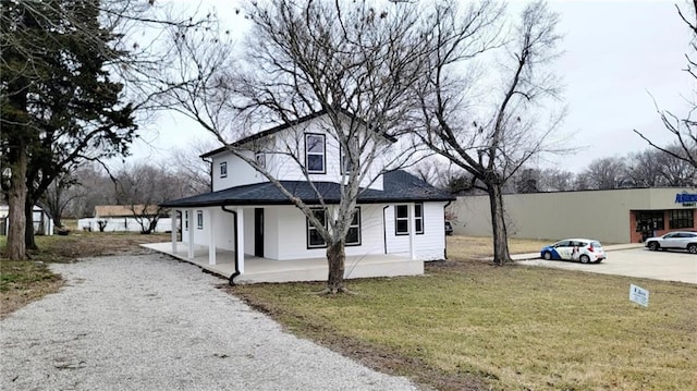 619 Main St, Mound City, KS 66056 - view of front of house with a front lawn