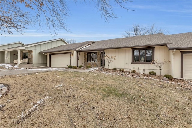 ranch-style house with roof with shingles and an attached garage