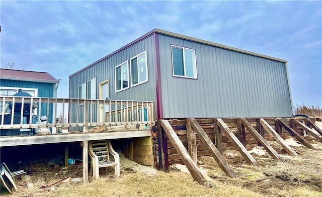 view of property exterior featuring a deck