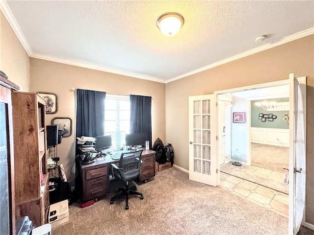 office space with ornamental molding, light colored carpet, a textured ceiling, and french doors