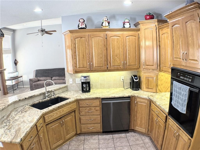 kitchen featuring light tile patterned flooring, sink, kitchen peninsula, dishwasher, and oven