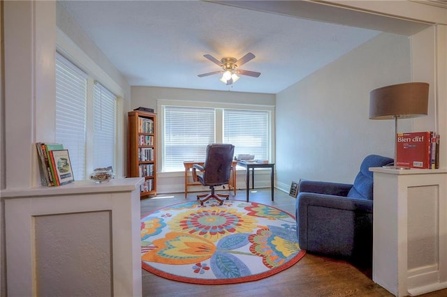 office area featuring dark hardwood / wood-style flooring and ceiling fan