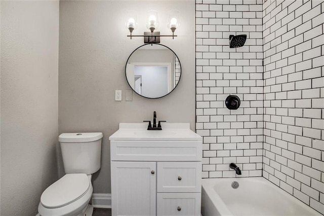 full bathroom featuring vanity, toilet, and tiled shower / bath combo