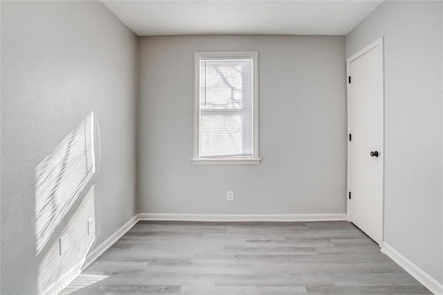 unfurnished room featuring light hardwood / wood-style flooring