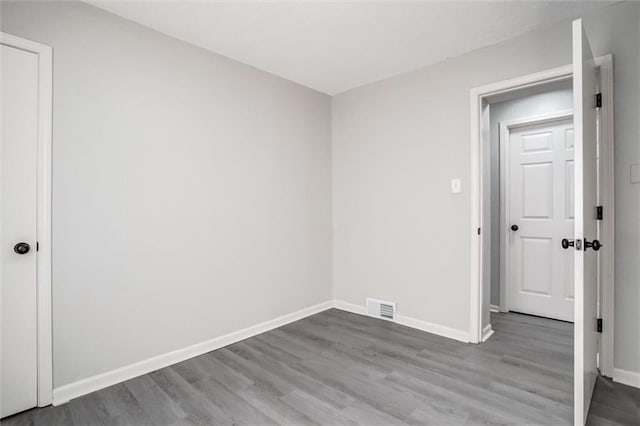 unfurnished room with light hardwood / wood-style flooring