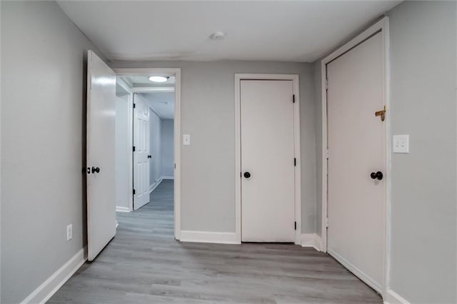 hallway featuring light hardwood / wood-style flooring