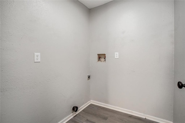 laundry room featuring dark hardwood / wood-style flooring, hookup for a washing machine, and hookup for an electric dryer