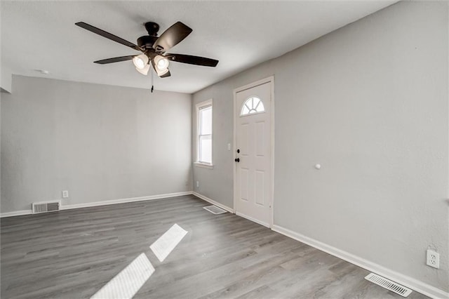 foyer entrance with hardwood / wood-style floors and ceiling fan