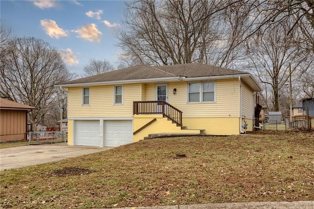 view of front of house with a garage and a front yard