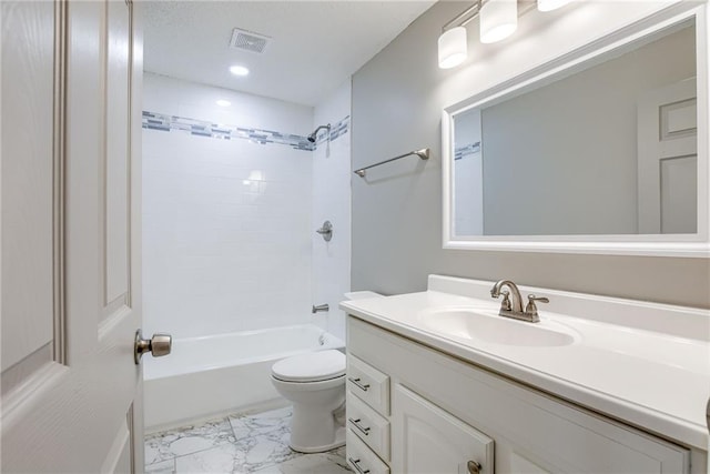 full bathroom featuring vanity, tiled shower / bath combo, and toilet